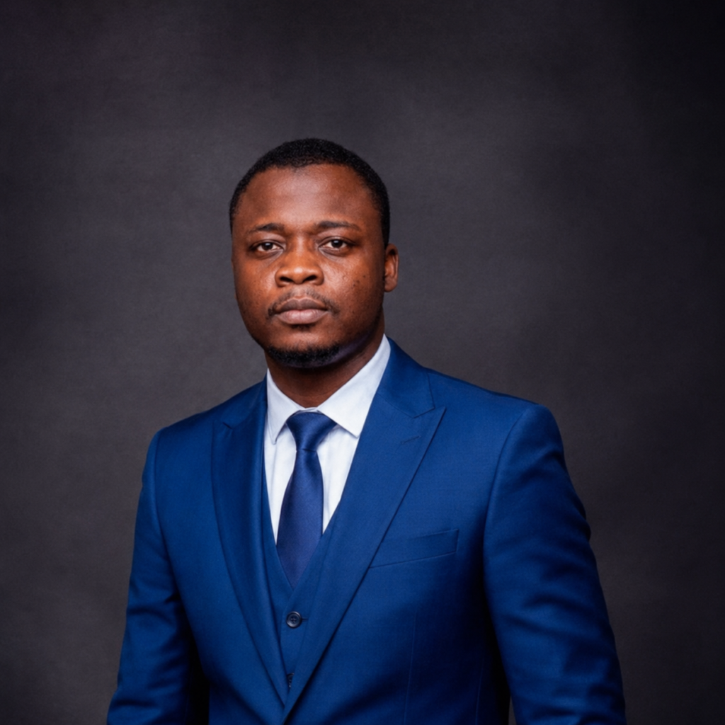 Portrait photo of habeeb in a blue suit, white shirt and tie.